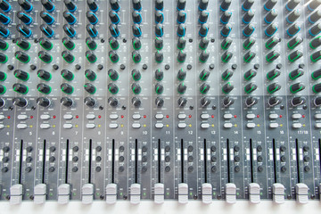 Audio sound mixer control panel top view.  Sound console buttons for adjust the volume