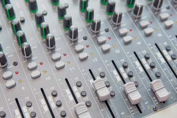 Audio sound mixer control panel.  Sound console buttons for adjust the volume