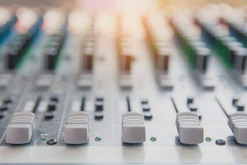 Audio sound mixer control panel.  Sound console buttons for adjust the volume