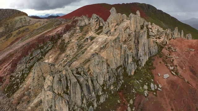 Aerial drone view of red clored mountain stones in Vinicunca, Rainbow Mountain, Peru