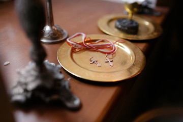 Obraz premium Accessories for the christening of children. Icons of candles and font, the Christian Armenian Church.