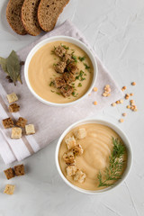 pea cream soup with croutons on a light background. The view from the top .