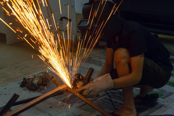 Electric wheel grinding cuting on steel. sparks from cutting