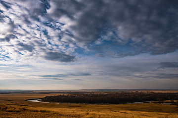 River in autumn field