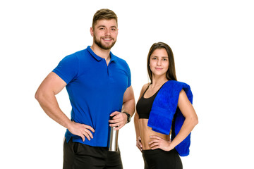 Cheerful athletic man and woman with towel after fitness exercise