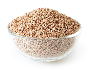 Roasted buckwheat grains in glass bowl isolated on white background with clipping path