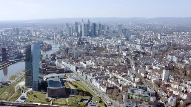 Flying over Frankfurt in Germany. Aerial view of the metropolis and the largest city of Hesse. It is a central German city on the river Main, is a major financial hub that's home to the European Bank