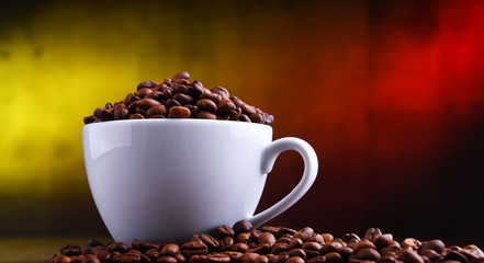 Composition with cup of coffee and beans