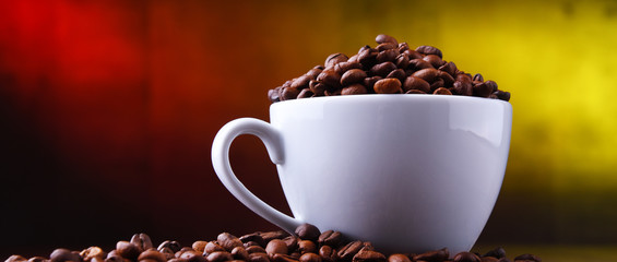 Composition with cup of coffee and beans