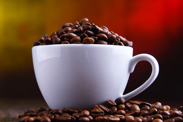 Composition with cup of coffee and beans