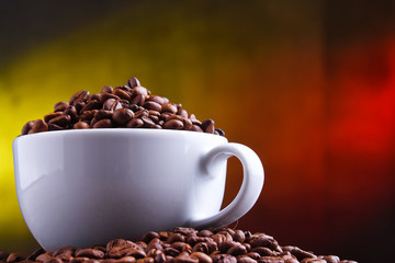 Composition with cup of coffee and beans