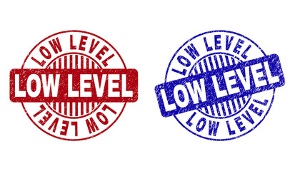 Grunge LOW LEVEL round stamp seals isolated on a white background. Round seals with grunge texture in red and blue colors. Vector rubber overlay of LOW LEVEL text inside circle form with stripes.