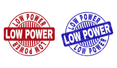 Grunge LOW POWER round stamp seals isolated on a white background. Round seals with grunge texture in red and blue colors. Vector rubber imprint of LOW POWER title inside circle form with stripes.