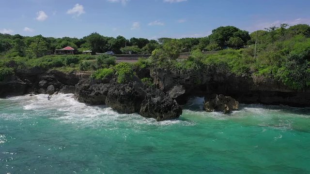 Nusa Dua. Bali / Indonesia - 01 20 2019. A drone&rsquo;s flight over the sea, cliffs and Geger Beach Temple