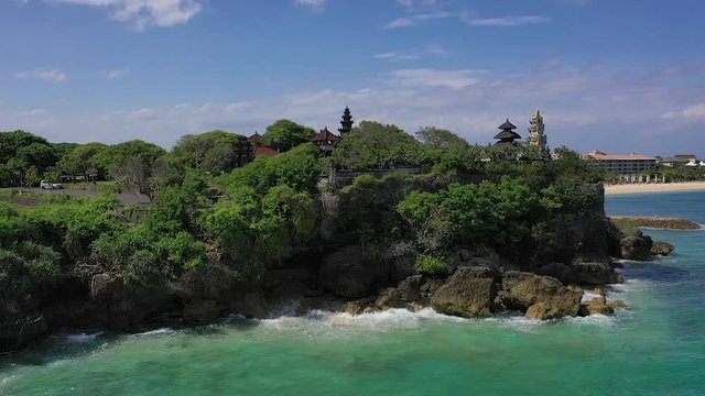 Nusa Dua. Bali / Indonesia - 01 20 2019. A drone&rsquo;s flight over the sea, cliffs and Geger Beach Temple