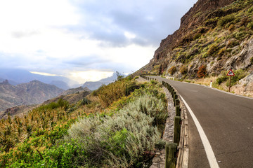Fototapeta na wymiar Summer road background in mountains and free space for your decoration. Gran Canaria island 