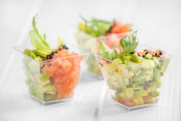 Vegetarian appetizer with avocado and tomato. Close-up. Concept for food, diet, healthy food, restaurant and catering.