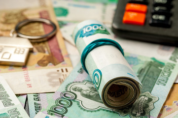Keychain on the background of russian ruble banknotes