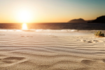 Summer background of sand on beach and blue sky with sun light. Free space for your decoration. 