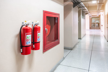 Fire extinguisher system on the wall background, powerful emergency equipment for industrial - obrazy, fototapety, plakaty