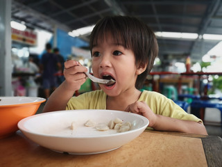 The boys eat the food by himself.
