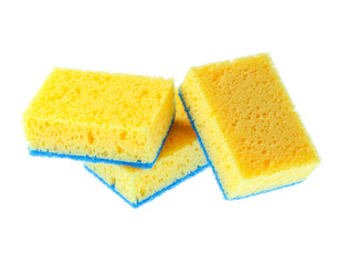 Three yellow cleaning sponges isolated on white background.