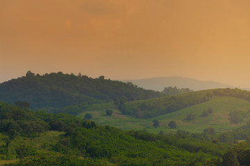 Landscape nature mountain view in tropical forest while sunset.