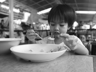 The boys eat the food by himself.