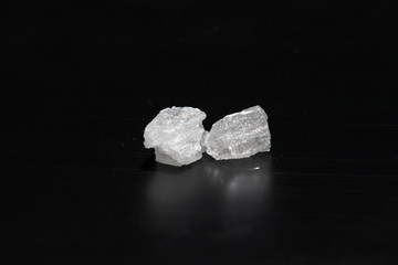 Crystal methamphetamine on a black background