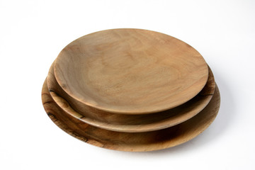 Stack of wooden plates on a white background