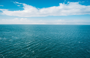 Obraz premium Blue sea and clouds on sky