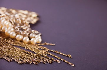 Golden Jewelry accessories on the black background