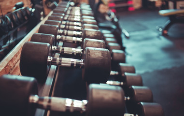 Obraz premium dumbbell rack close-up in the gym