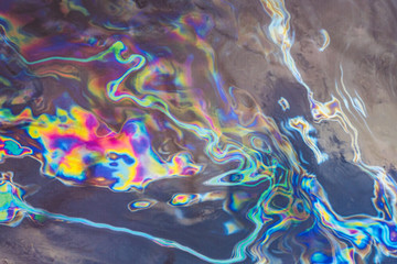 oil on dark fabric creating fantastic abstract colourful patterns and images