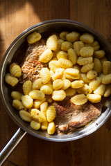 Gnocchi with pork chops and sauce 