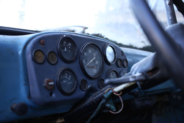 Dashboard of the old truck consisting of the following indicators: speedometer, oil level measurement, coolant temperature and other measuring devices.