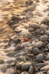 Fototapeta na wymiar Beach pebbles at Cape Dramont near Saint-Raphael