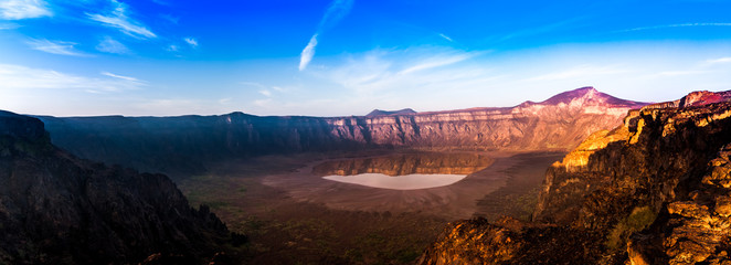 A stunning view of the Al Wahbah crater on a sunny day, Saudi Arabia - obrazy, fototapety, plakaty