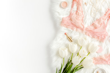 Flat lay set of sexy, lacy, pink lingerie, accessories on white background. Top view.
