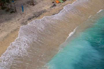 2018_1_19 Nusa Penisa, BALI. Aerial or Top view of colorful Atuh beach. Turquoise water, white sand beach, warm sunlight, sun loungers and parasols. Tourist popular destination/attraction in Indonesia