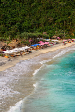 2018_1_19 Nusa Penisa, BALI. Aerial or Top view of colorful Atuh beach. Turquoise water, white sand beach, warm sunlight, sun loungers and parasols. Tourist popular destination/attraction in Indonesia