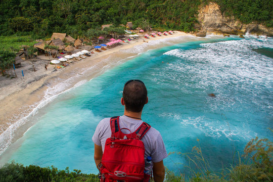 2018_1_19 Nusa Penisa, BALI. Aerial or Top view of colorful Atuh beach. Turquoise water, white sand beach, warm sunlight, sun loungers and parasols. Tourist popular destination/attraction in Indonesia