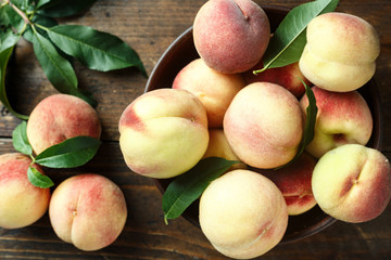peaches on wooden background