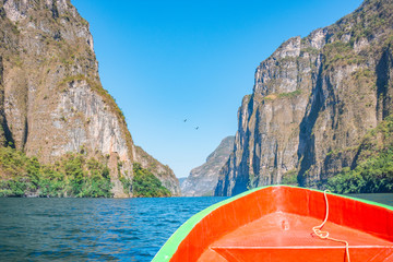 Boat navigating over the amazing Sumidero Canyon National Park, located in Chiapas Mexico