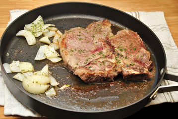 Searing a Porterhouse Steak in a Fry Pan with Onions