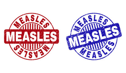 Grunge MEASLES round stamp seals isolated on a white background. Round seals with distress texture in red and blue colors. Vector rubber imprint of MEASLES title inside circle form with stripes.