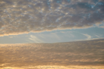 Beautiful sunset sky above clouds with dramatic light
