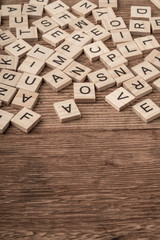 cube letters on a wooden table as a background