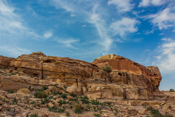 Fototapeta premium picturesque Middle East sand stone rocks desert scenery mountain wilderness landscape environment in vivid colorful photography with contrast blue sky background