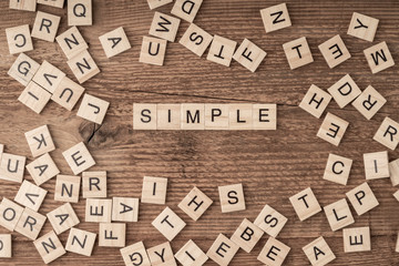 the word simple written with wooden letters